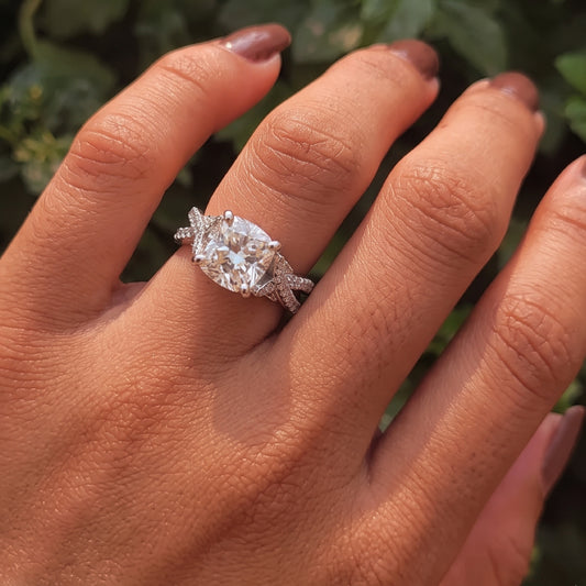 4 Ct cushion cut diamond engagement ring on finger