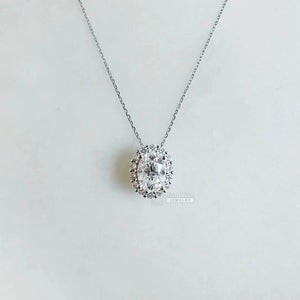 1 Ct Oval Moissanite Drop Halo Pendant In 14K Gold