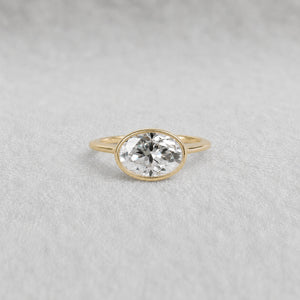 2 Ct East West Oval Bezel Lab Grown Diamond Engagement Ring in 14K Yellow Gold