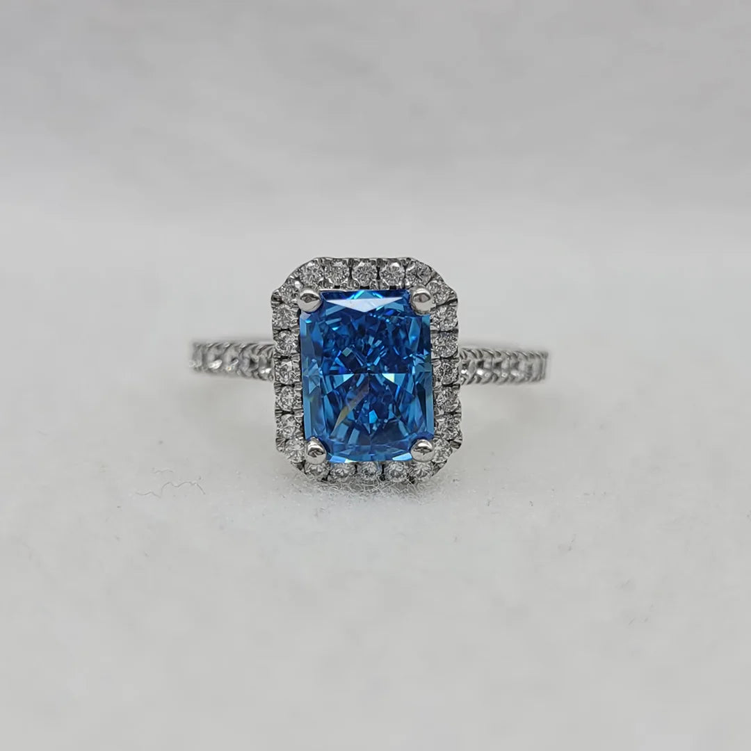 2.5 Ct emerald cut blue sapphire engagement ring in 14K white gold