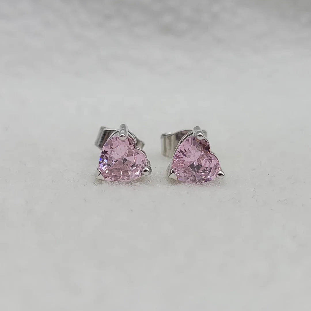 Pink sapphire heart earrings in sterling silver