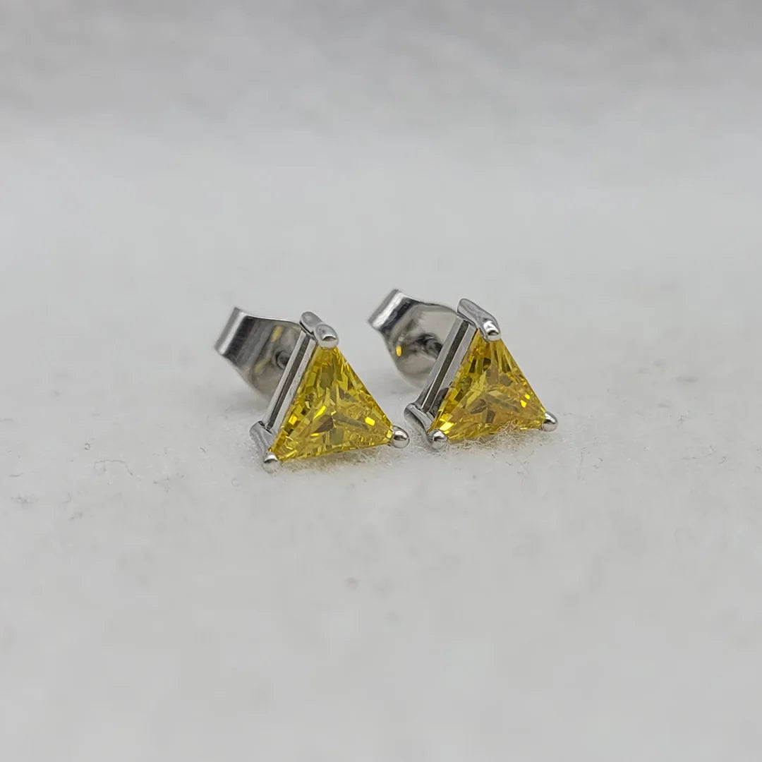 Triangle cut yellow lab sapphire earrings close up