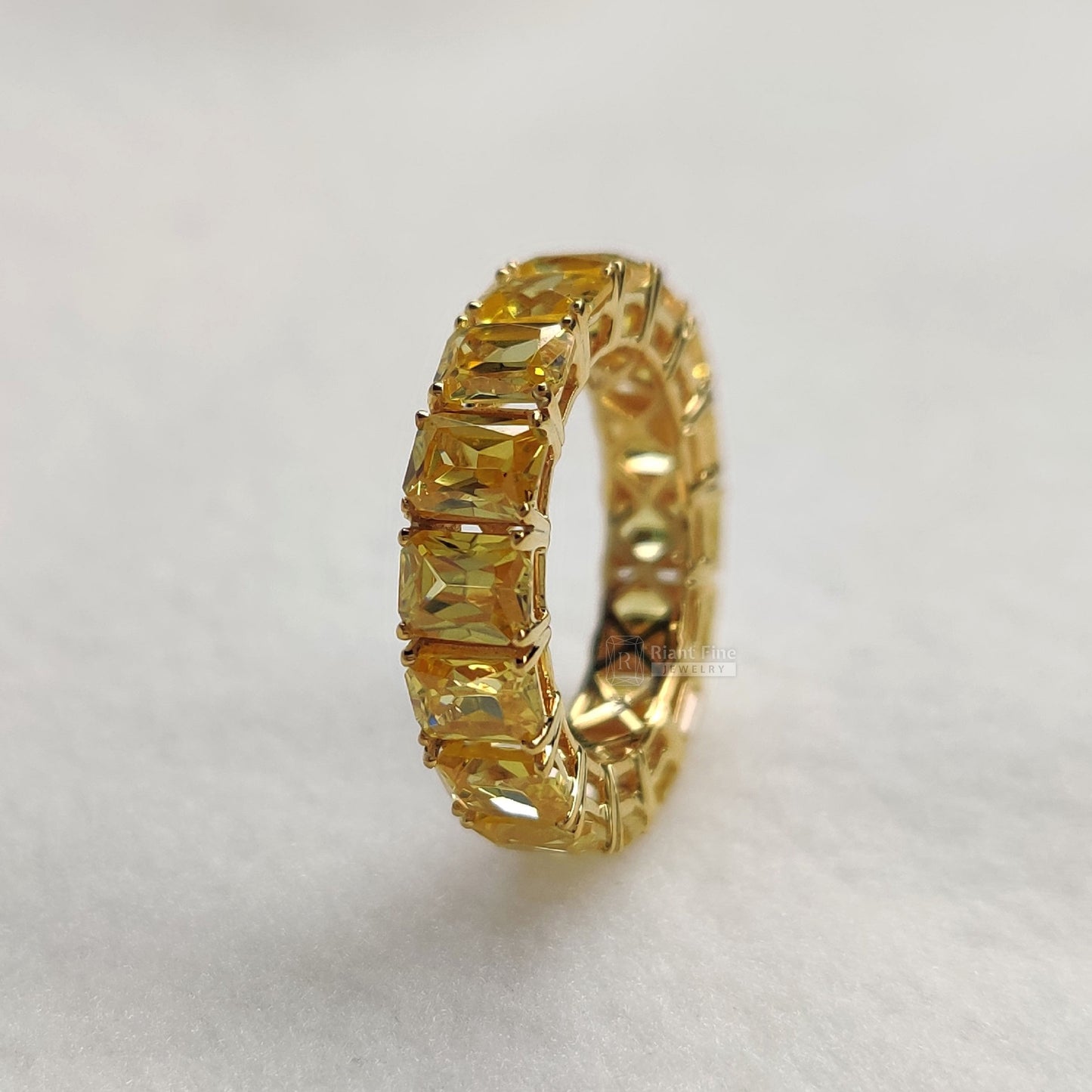 emerald lab diamond wedding band in yellow gold