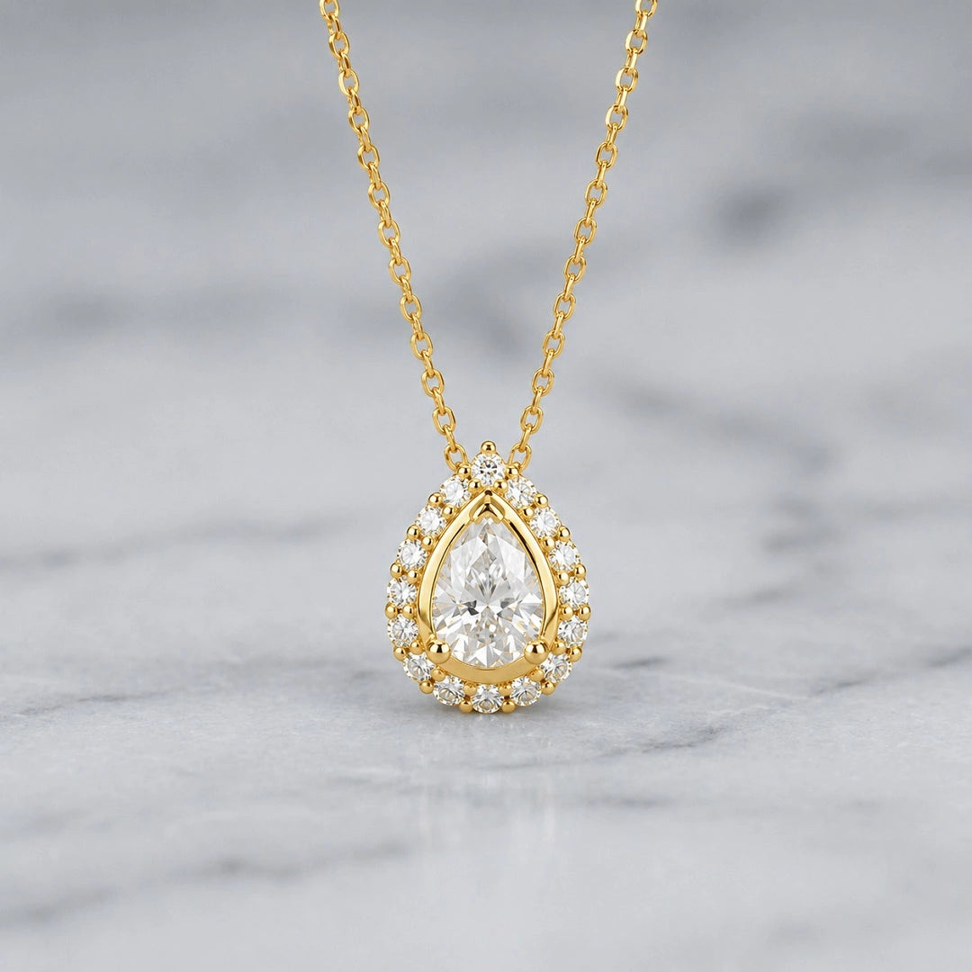 14k yellow gold pear cut moissanite halo pendant necklace main view