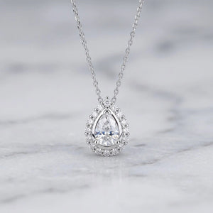Halo Pear Shaped Moissanite Pendant In 14K Gold